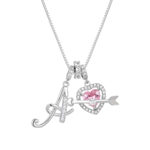 Macro shot of silver letter A pendant and pink heart zircon with cupid arrow detail