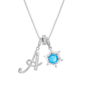 Close-up of zircon letter A and snowflake pendant with blue stone on silver chain