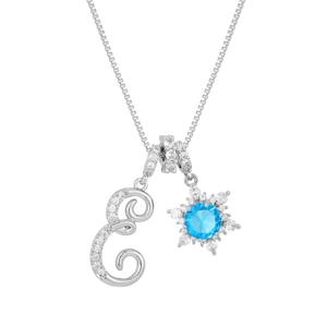 Detailed macro view of silver starburst pendant with a blue gemstone on a box chain