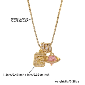 Detail of gold box chain with Z letter pendant and pink heart zircon charm size info