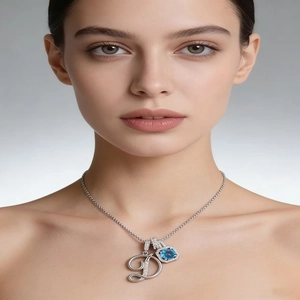 Silver alphabet D necklace with blue gemstone and pavé rhinestones on elegant chain