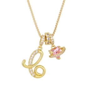 Detail of gold-plated 3-in-1 necklace with pink heart planet and crystal letter L charm