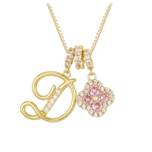 Detail of gold letter D and clover pendant necklace with pink and white zircon stones