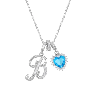Detail of letter B pendant with heart-shaped blue gemstone and sparkling zirconias