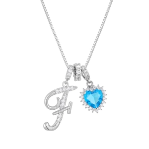Silver necklace with iced letter F and heart-shaped blue gemstone pendant on box chain