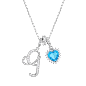 Detail of blue zircon heart pendant with crystal letter G on a classic box chain necklace