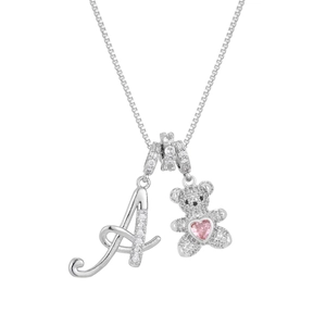 Detailed shot of silver bear charm with pink heart and pavé diamond letter A pendant necklace