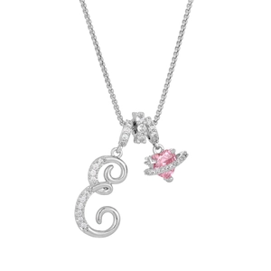 Macro view of crystal letter E pendant with pink heart Saturn charm on silver chain
