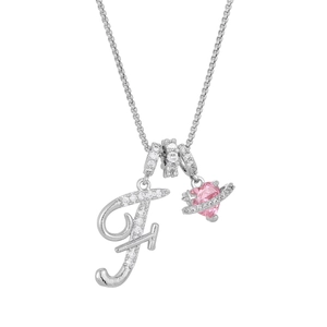 Detail of silver letter F pendant with pink heart and crystal orbit on chain