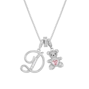 Detail of silver necklace with crystal letter D, teddy bear pendant and pink heart gem