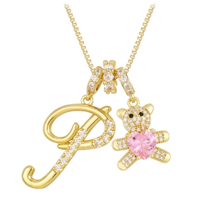 Detail of gold necklace with letter P pendant and crystal bear holding a pink heart
