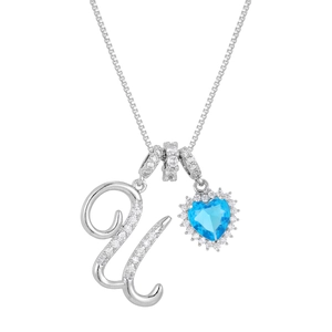 Macro shot of silver letter U and blue heart pendant necklace with shimmering zircons