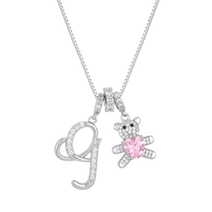 Silver bear pendant necklace with letter G and pink heart crystal on white background