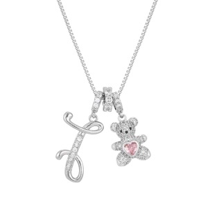 Close-up of silver teddy bear pendant with pink heart stone and crystal letter J charm