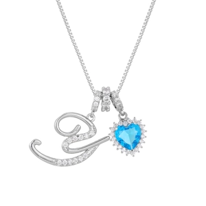 Detail of silver letter E necklace with blue heart gemstone and pave zircon crystals
