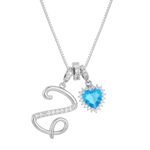 Detail view of silver letter S pendant and blue heart zirconia on a box chain necklace