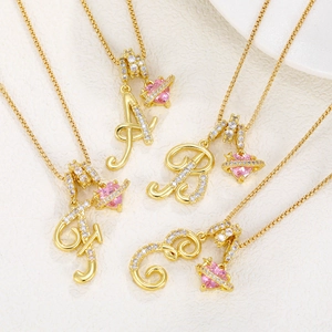 Gold letter necklace with pink heart saturn pendant and zircon stones for women