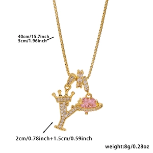 Detail of gold letter Y pendant with crown, pink heart stone and sizing measurements