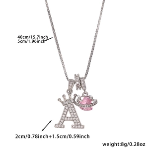 Detail view of crown letter A pendant with pink heart charm and 40 plus 5cm box chain dimensions