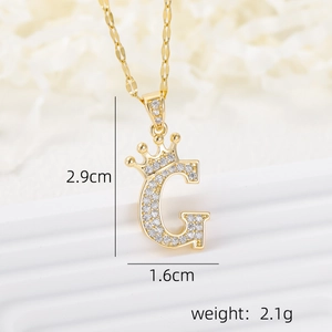 Detail of 18k gold plated crown letter G pendant necklace with micro-pave cubic zirconia