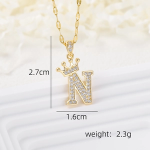 Macro shot showing dimensions 2.7x1.6cm of crown letter N pendant with pavé zircons