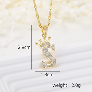 Macro view of 18k gold plated crown letter S pendant with zircon micro-paving details