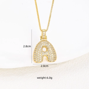 Detail view of gold chubby letter A pendant with zircon inlay showing dimensions 2.8x2.0cm