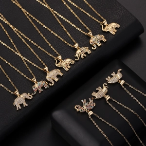 Detail of elephant pendants with white and multicolored cubic zirconia on gold chains