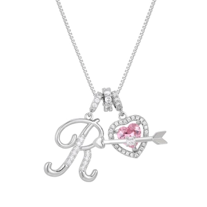 Detail of silver necklace with pink heart stone, zircon letter R, and cupid arrow