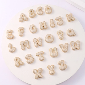 Detailed full set of 26 gold bubble letters with sparkling crystals for jewelry making