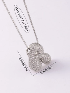Detail showing crystal-paved silver animal pendant with 45cm chain dimensions