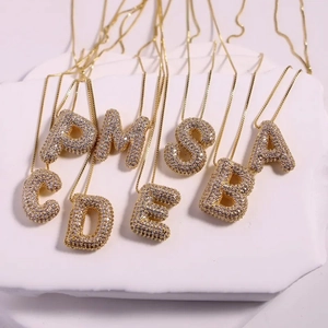 Detail of diverse 26 English balloon letter pendants with micro-pave cubic zirconia stones