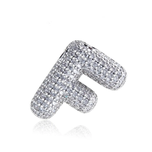 Close-up of iced out silver letter F pendant with micro-paved sparkling cubic zirconia