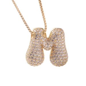 Gold bubble letter M pendant necklace with sparkling pavé crystals on a box chain
