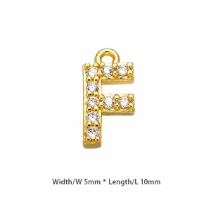 Detail shot of a gold-plated letter F pendant with cubic zirconia, size 10mm by 5mm