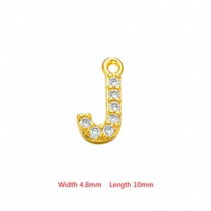 Detailed close-up of gold letter J pendant with zircon inlay measuring 4.8mm by 10mm