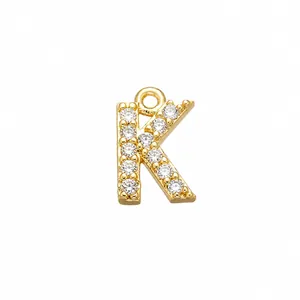 Detailed macro view of gold-plated letter K pendant with cubic zirconia inlay, size 5.7x9.2mm