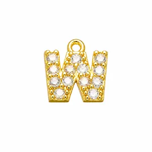 Detailed view of capital letter W pendant with gold plating and clear cubic zirconia stones