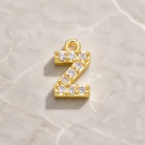 Macro view of gold-plated letter Z pendant with clear cubic zirconia micro-pave setting