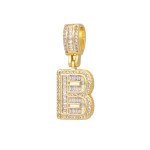 Close-up of 18k gold plated letter B pendant with baguette-cut and round cubic zirconia