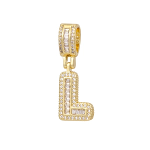 Detailed close-up of iced out letter L pendant with 18k gold plating and baguette zircons