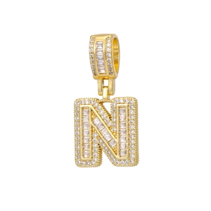 Detailed close-up of 18k gold plated letter N pendant with cubic zirconia stones