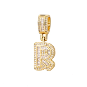 Detailed view of the 18k gold plated letter R pendant encrusted with sparkling zircons