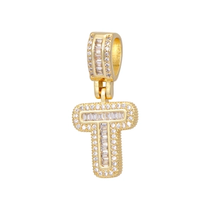 Detailed macro view of an iced-out 18k gold-plated letter T pendant with baguette zircons