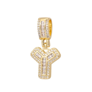 Close-up of gold-plated letter Y pendant with iced out cubic zirconia stones