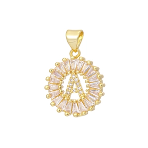 Macro view of gold plated letter A pendant with baguette and round cubic zirconia crystals