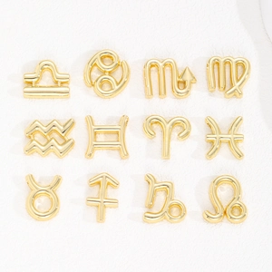 Set of 12 gold-plated 3D bubble zodiac constellation pendants in a organized grid layout