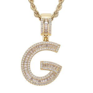 Detailed view of hip hop letter G pendant set with sparkling cubic zirconia on twist chain