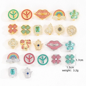 Macro view of assorted micro-pave zircon charms in gold and silver plating