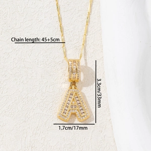 Detail showing letter A pendant with sparkling cubic zirconia on a golden chain